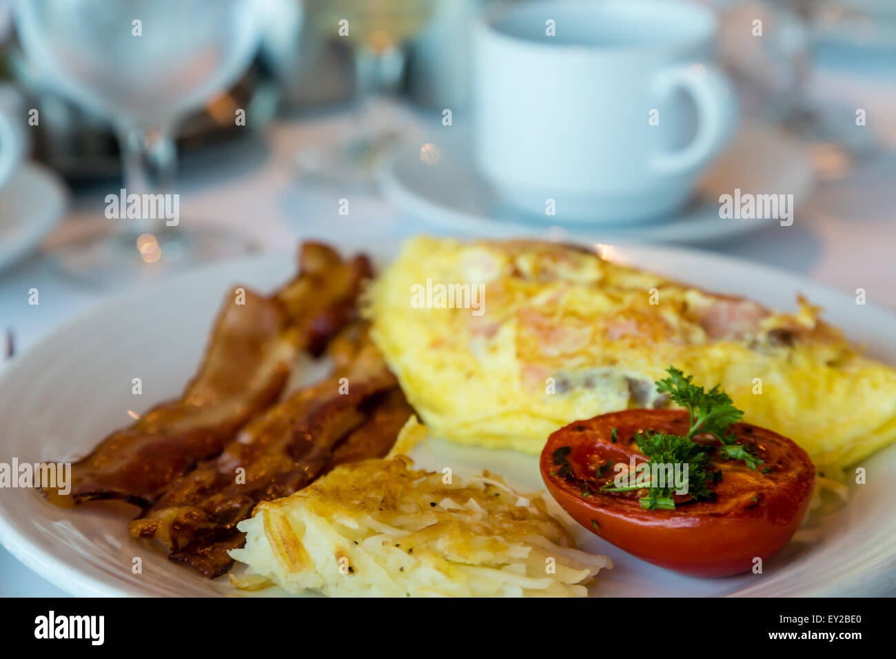 A fresh Omelet of smoked salmon and cheese with Bacon Hash Browns and