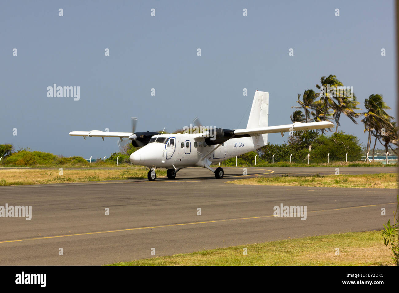 SVG Air Twin Otter Plane Taxis into Union Island Airport Stock Photo ...