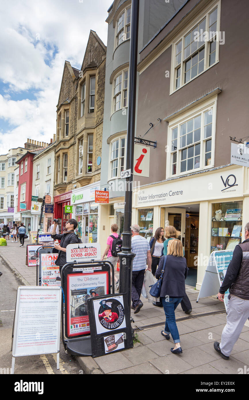 An Oxford street cluttered with shop signs, Oxford, Oxfordshire, England, UK Stock Photo