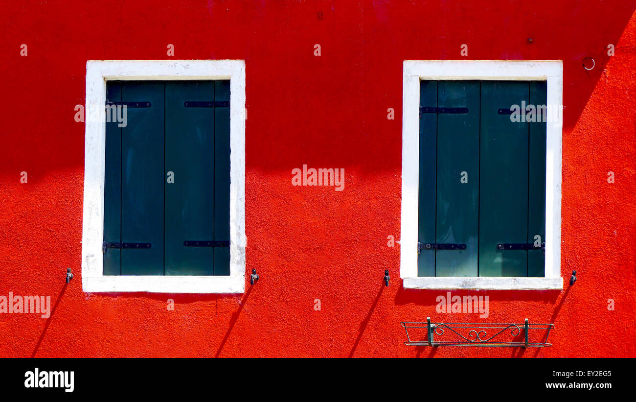 Red house two white windows hi-res stock photography and images - Alamy