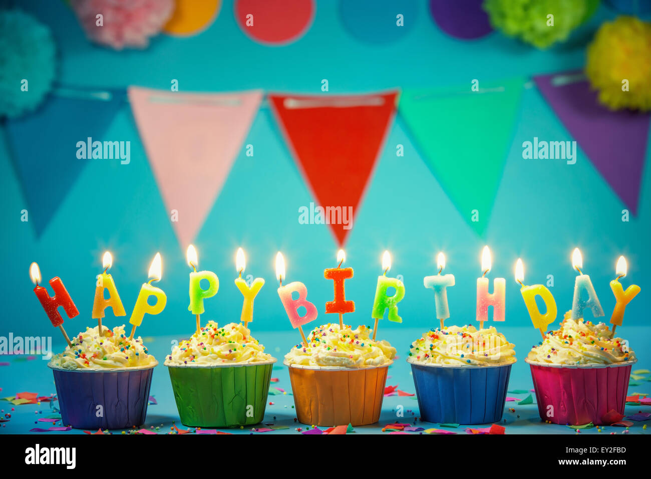 Tasty birthday cupcake with candles Stock Photo