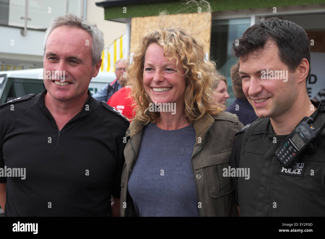 Royal Welsh Show, Builth Wells, Powys, UK July 2015. Photo shows TV celebrity and smallholder farmer Kate Humble posing with two local police officers at the show. Stock Photo