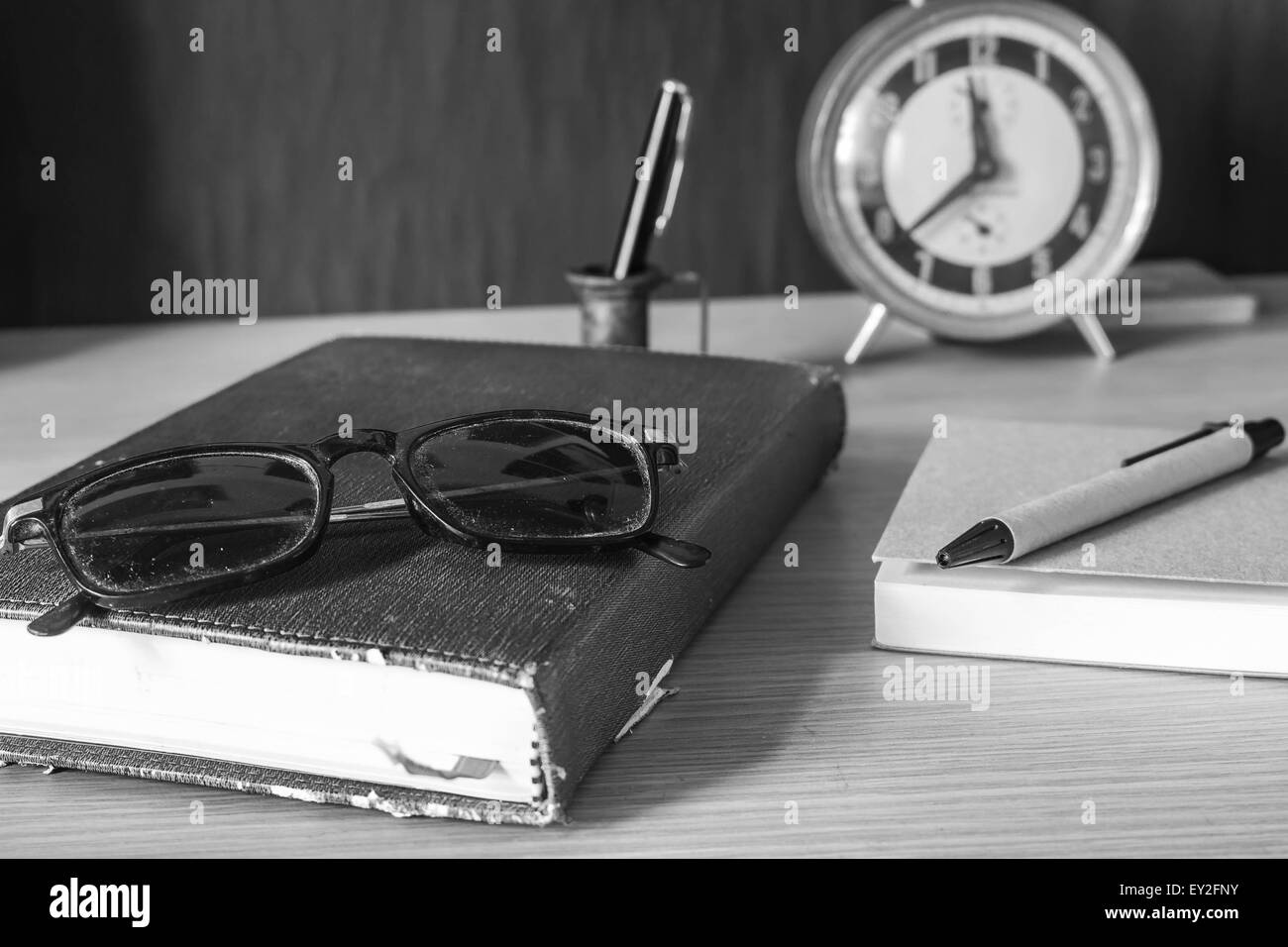 Glasses and stationery old dusty on the table. Stock Photo