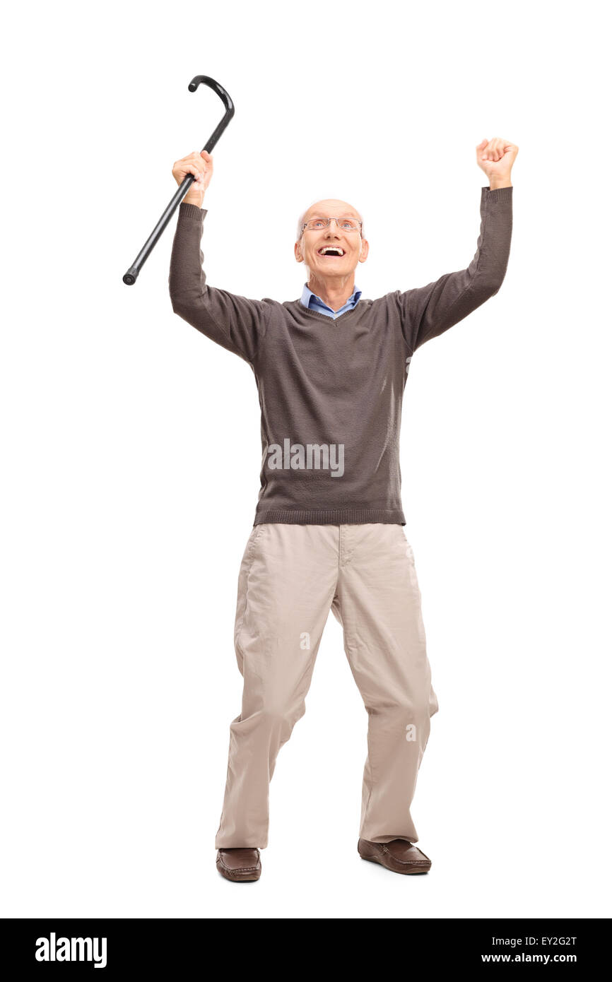 Full length portrait of an overjoyed senior holding a black cane an looking up isolated on white background Stock Photo