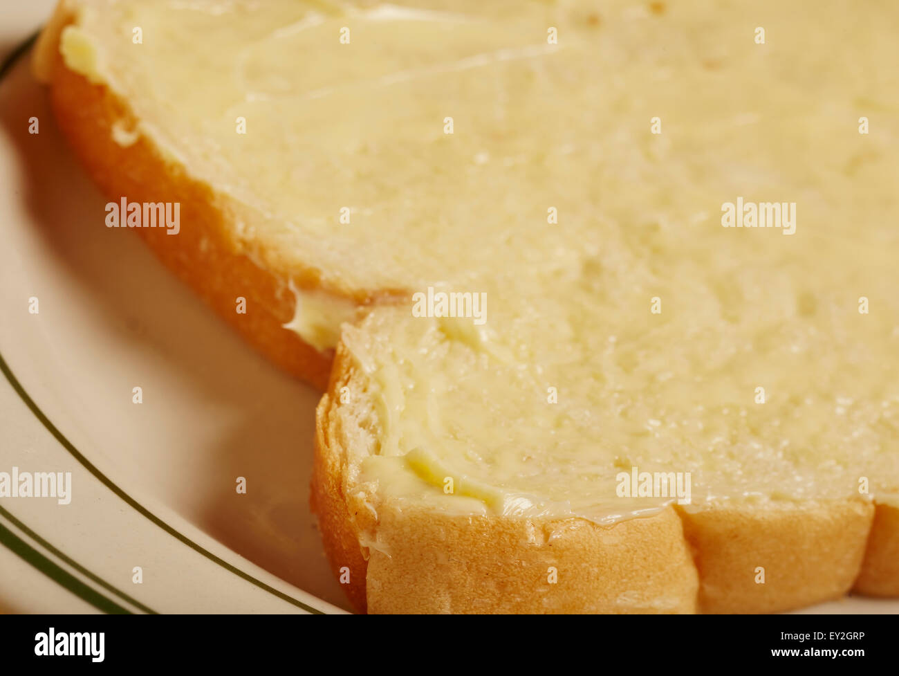 a slice of buttered white sandwich bread typical American and British
