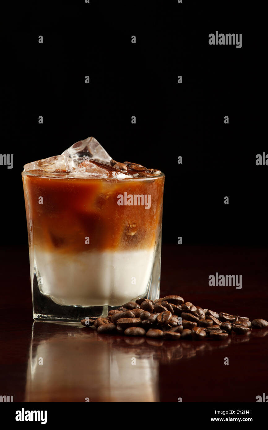 White Russian made with vodka, coffee liqueur and cream. Coffee beans as garnish Stock Photo Alamy