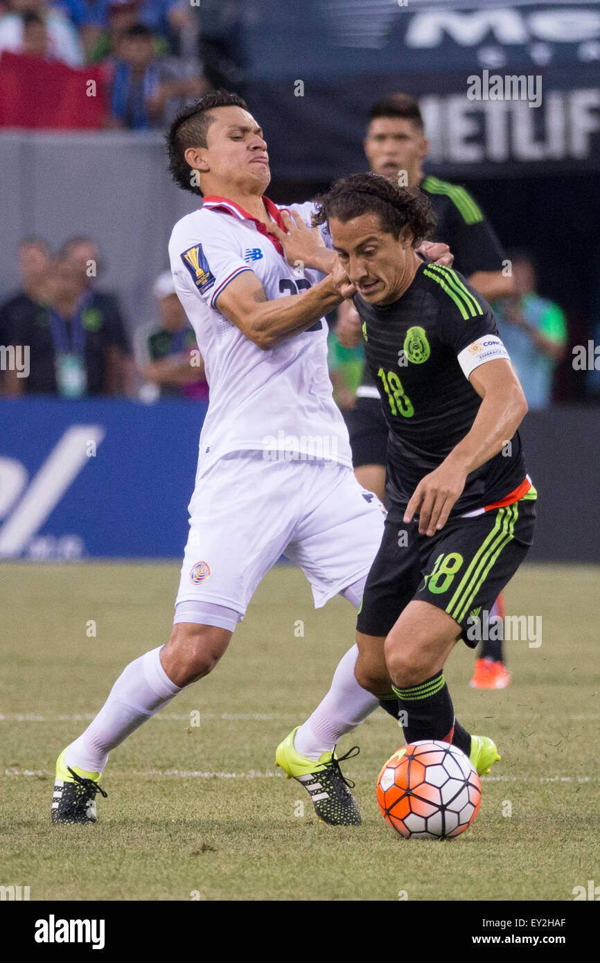 July 19, 2015: Mexico midfielder Andres Guardado (18) battles with Costa Rica midfielder Jose Miguel Cubero (22) for the ball during the CONCACAF Gold Cup 2015 Quarterfinal match between the Costa Rica and Mexico at MetLife Stadium in East Rutherford, New Jersey. Mexico won 1-0. (Christopher Szagola/Cal Sport Media) Stock Photo
