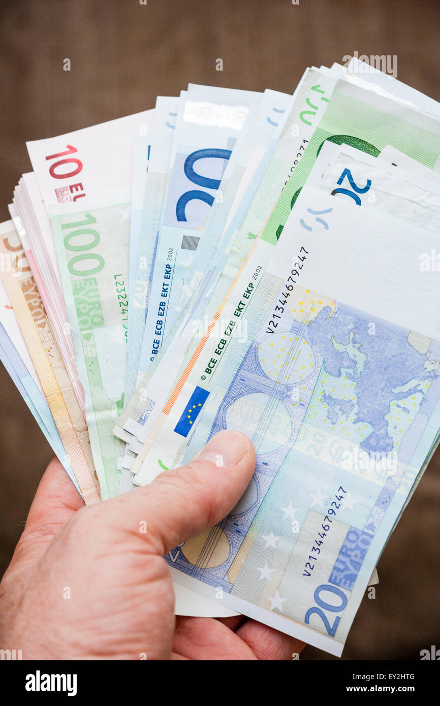 Close Up Of Caucasian Hand Holding A Wad Of Cash Euro Banknotes Fanned Out Against Plain Background Stock Photo Alamy Close Up Of Caucasian Hand Holding A Wad Of Cash Euro Banknotes Fanned Out Against Plain Background Stock Photo Alamy