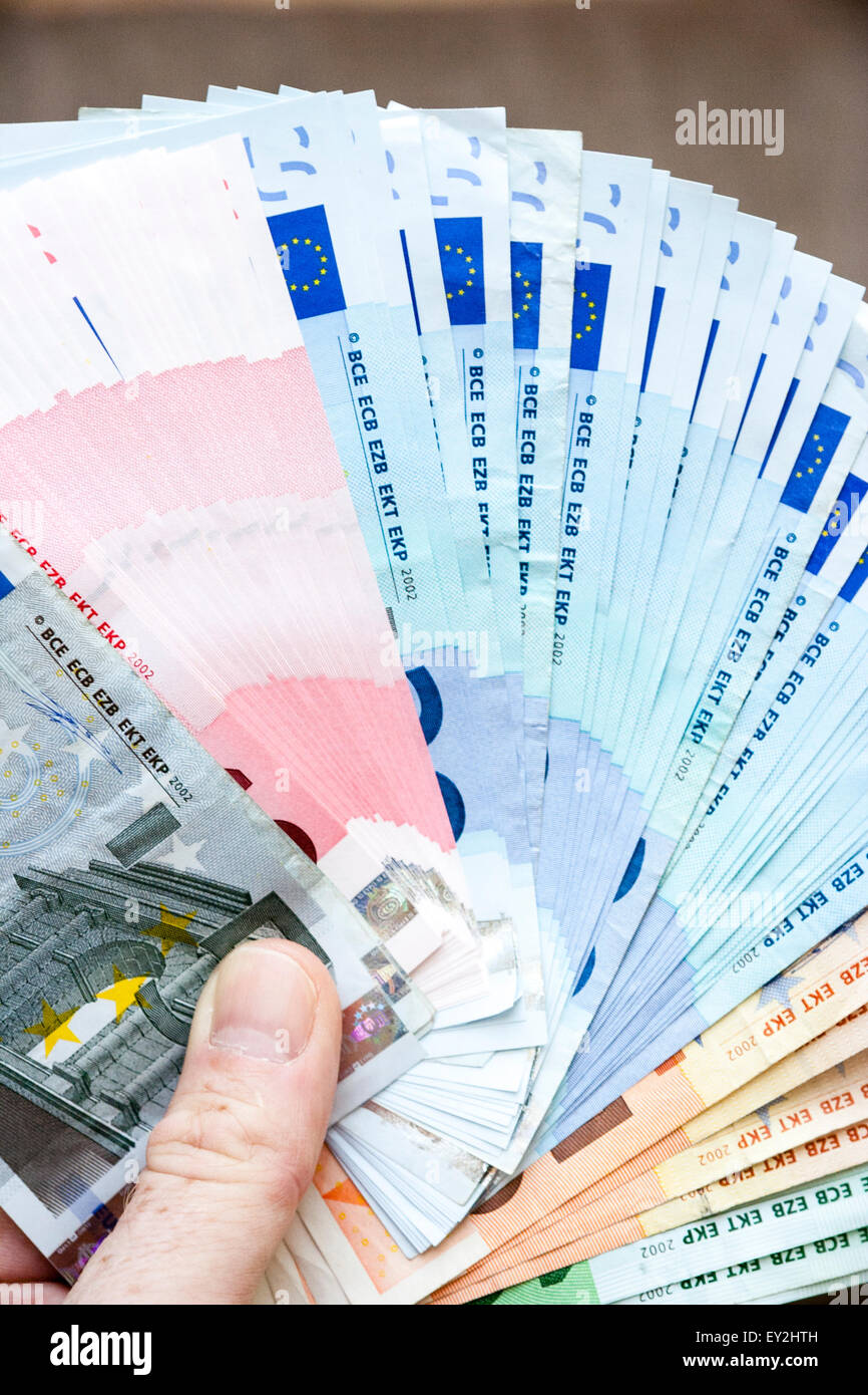 close up of caucasian hand holding a wad of cash euro banknotes stock photo alamy https www alamy com stock photo close up of caucasian hand holding a wad of cash euro banknotes fanned 85495105 html