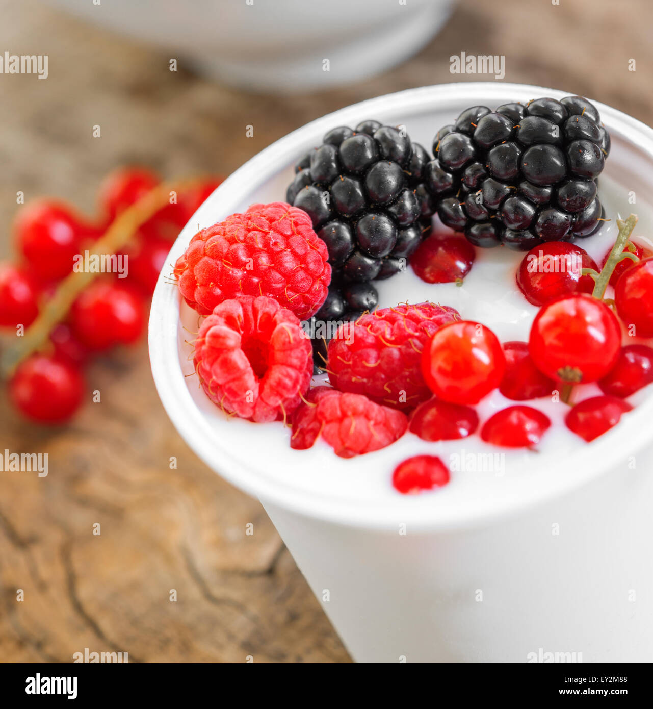 lowfat plain yogurt creamy wild berries flavor Stock Photo Alamy