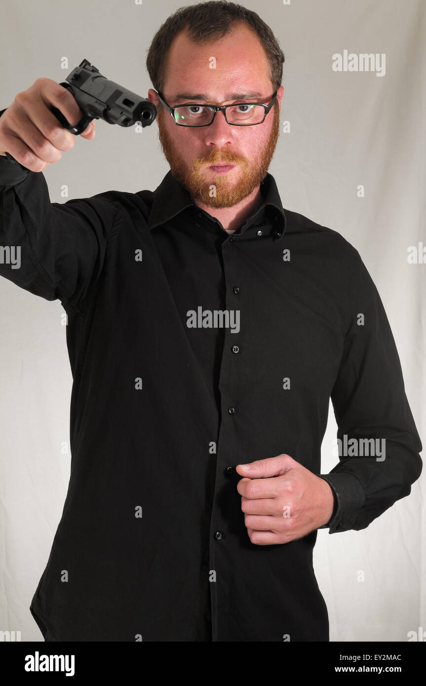 Man Holding a Pistol Gun Stock Photo - Alamy