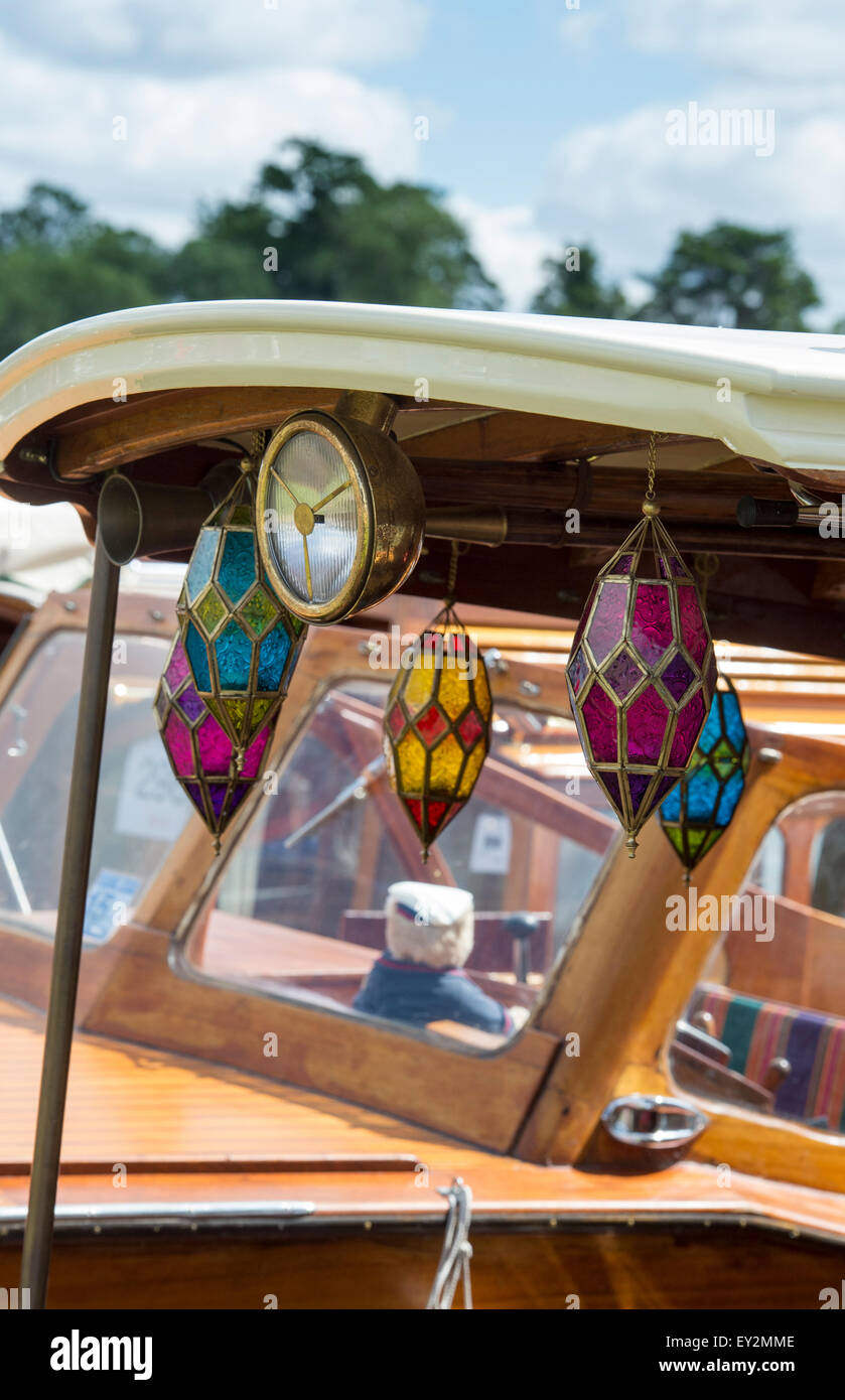 Colourful glass candle holders hanging on a wooden boat at the Thames Traditional Boat Festival, Henley On Thames, Oxfordshire, England Stock Photo