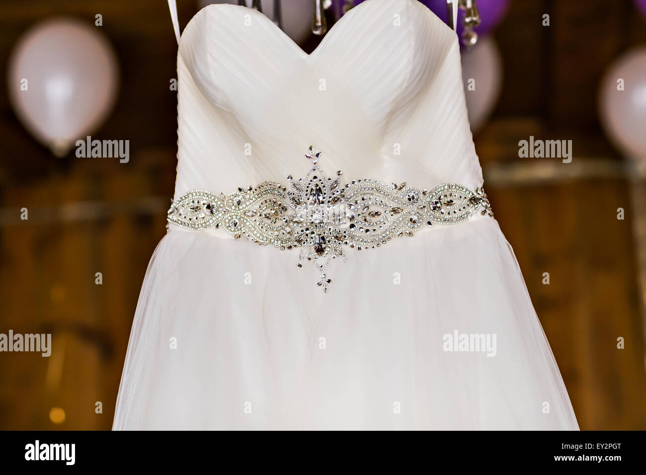 wedding dress hanging Stock Photo - Alamy