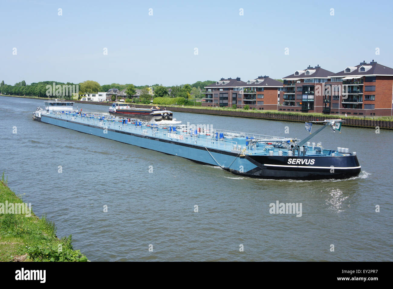 This image captures a container ship on the Amsterdam-Rijn Canal ...