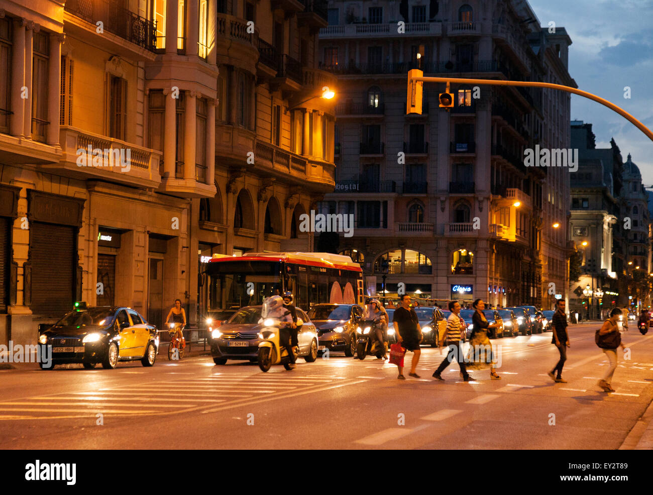 Traffic and people crossing the Via Laietana at night, Gothic Quarter, Barcelona city centre, Spain Europe Stock Photo