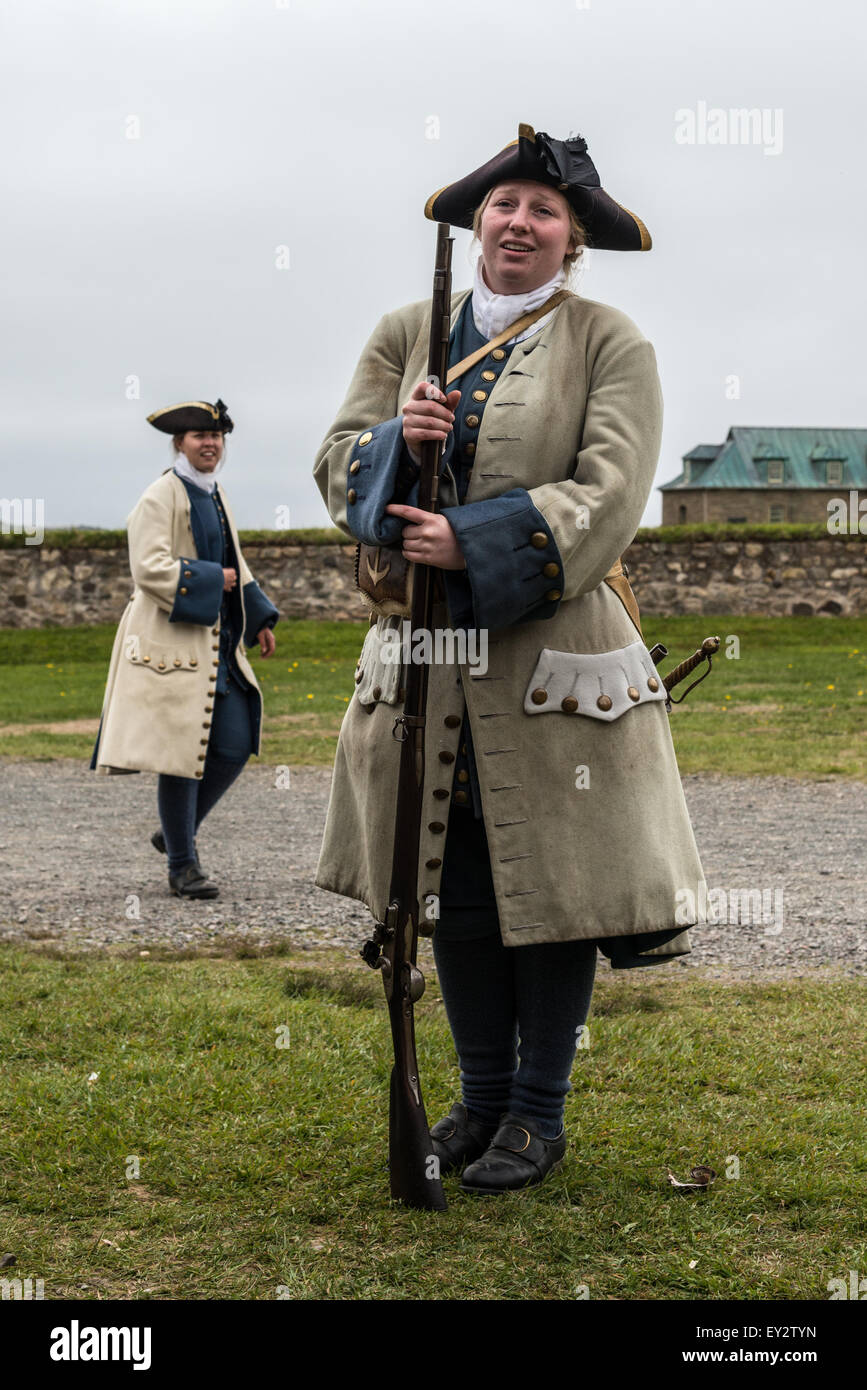 Female tour guides dressed as soldiers at Fortress Louisbourg, Louisbourg, Nova Scotia, Canada - Stock Image
