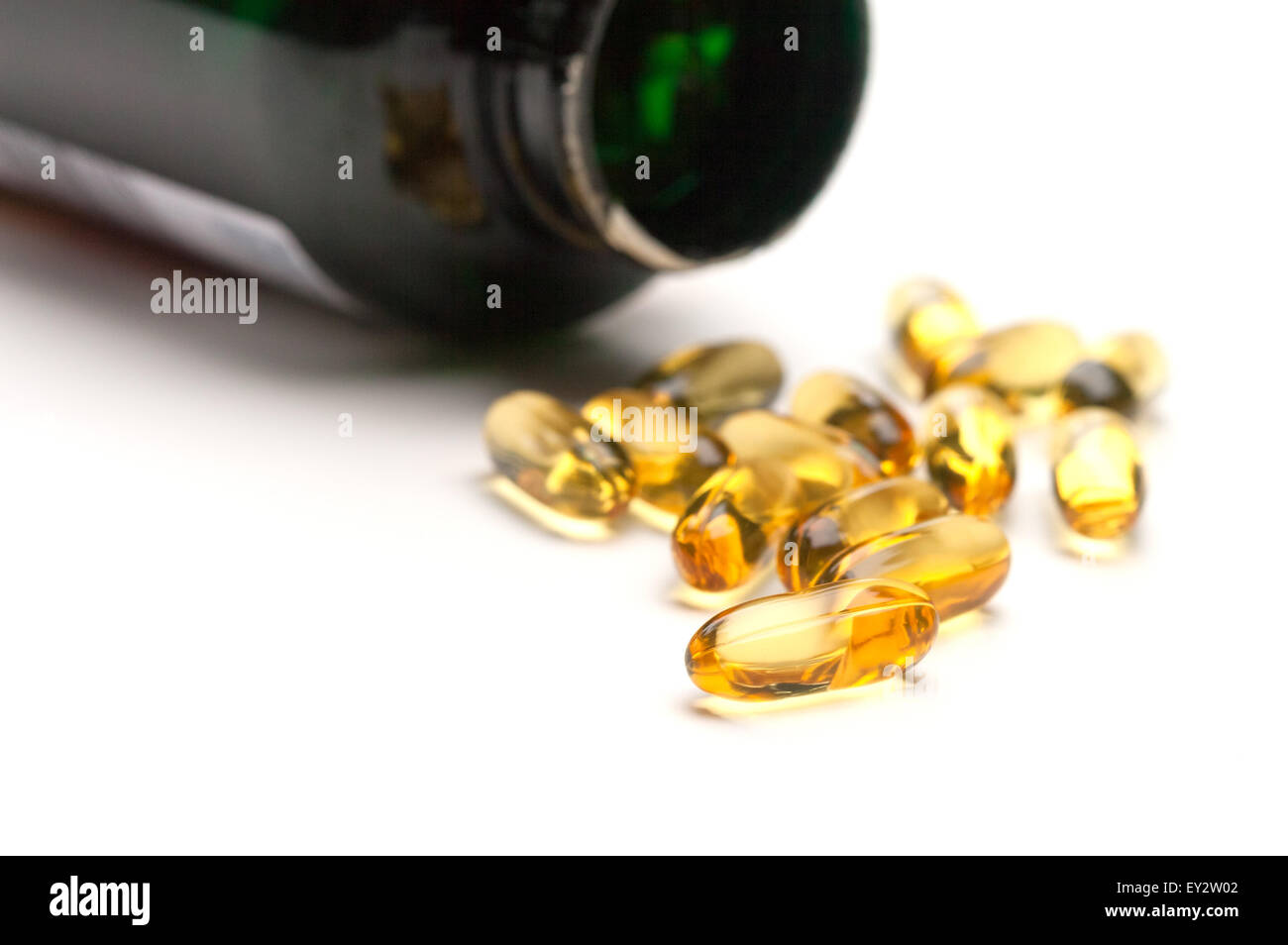 Spilled bottle of Fish Oil Capsules on a white background Stock Photo