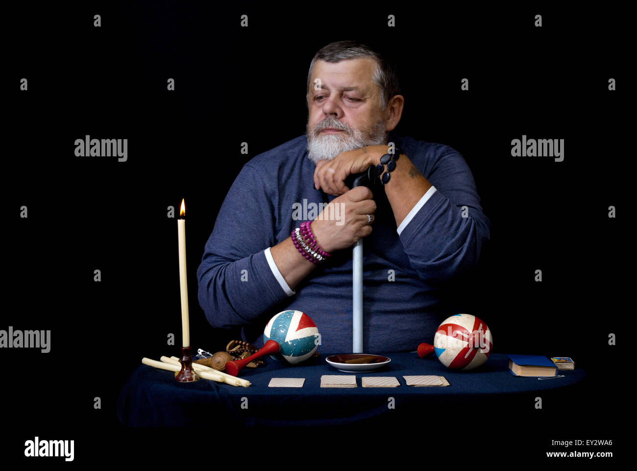 Portrait of old man looking on a candlelight Stock Photo