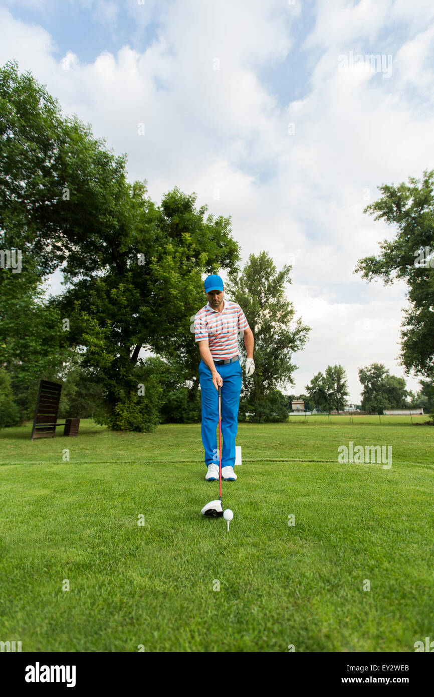 Young man playing golf Stock Photo
