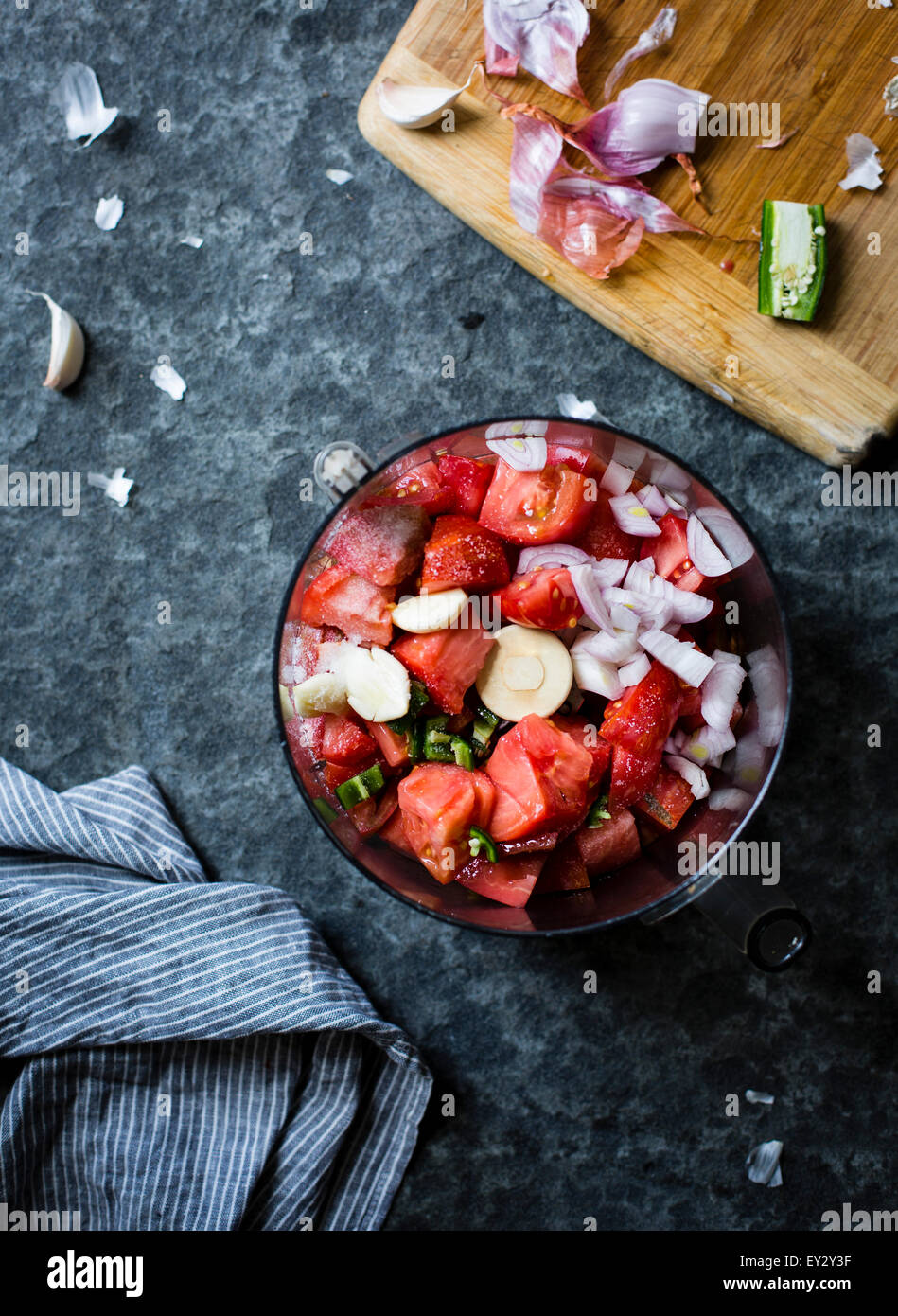 Chopped tomato and onion in a food blender. Stock Photo