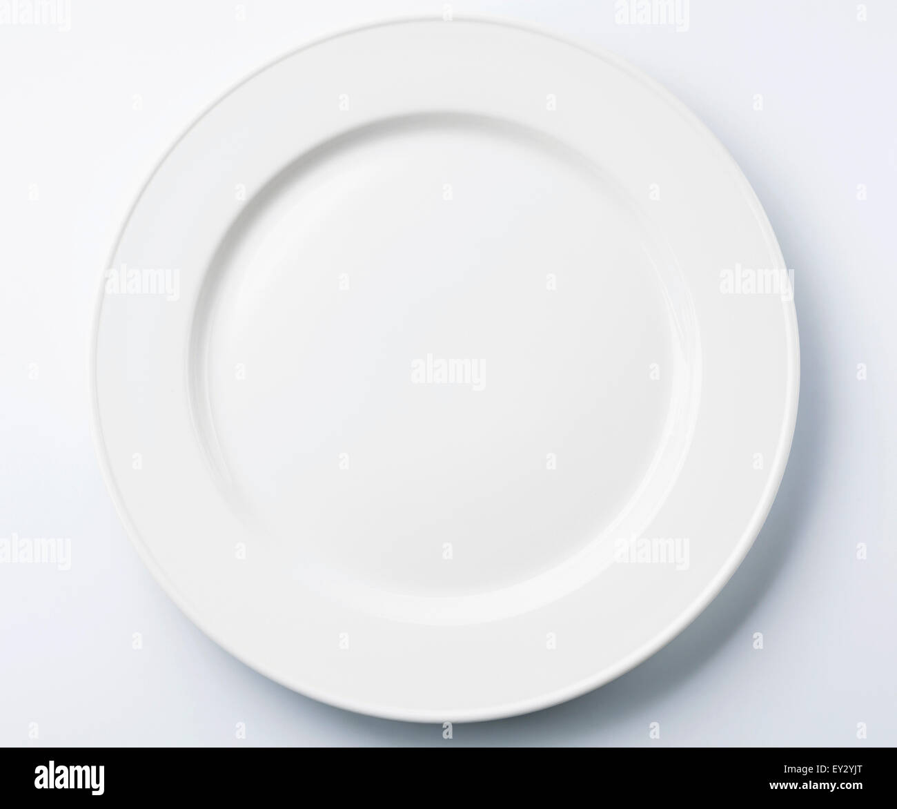 White empty plate on white background Stock Photo - Alamy