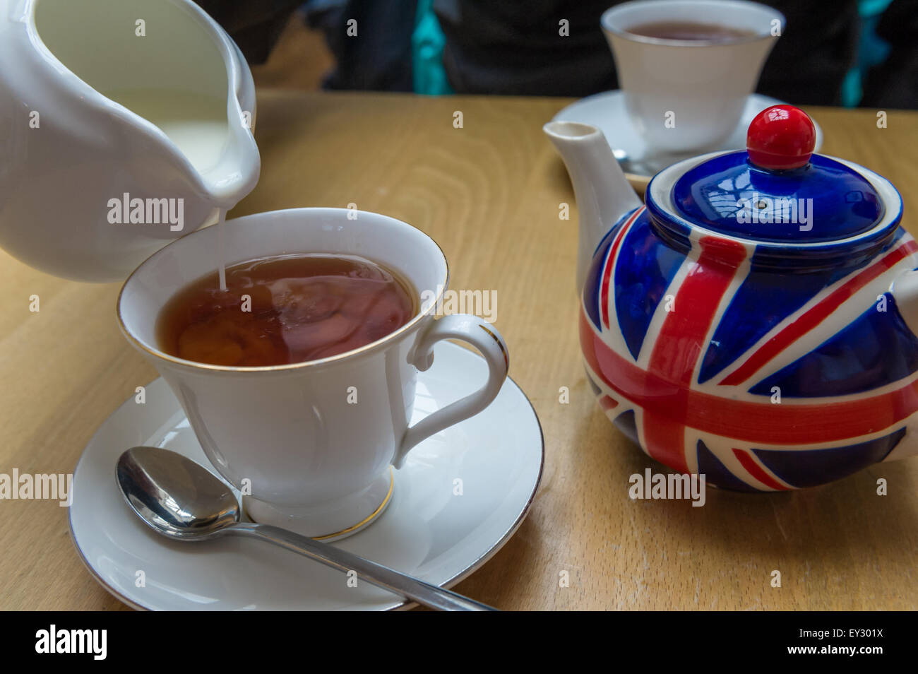 Union Jack Tea Cup of tea from a Union jack painted tea pot Stock Photo - Alamy