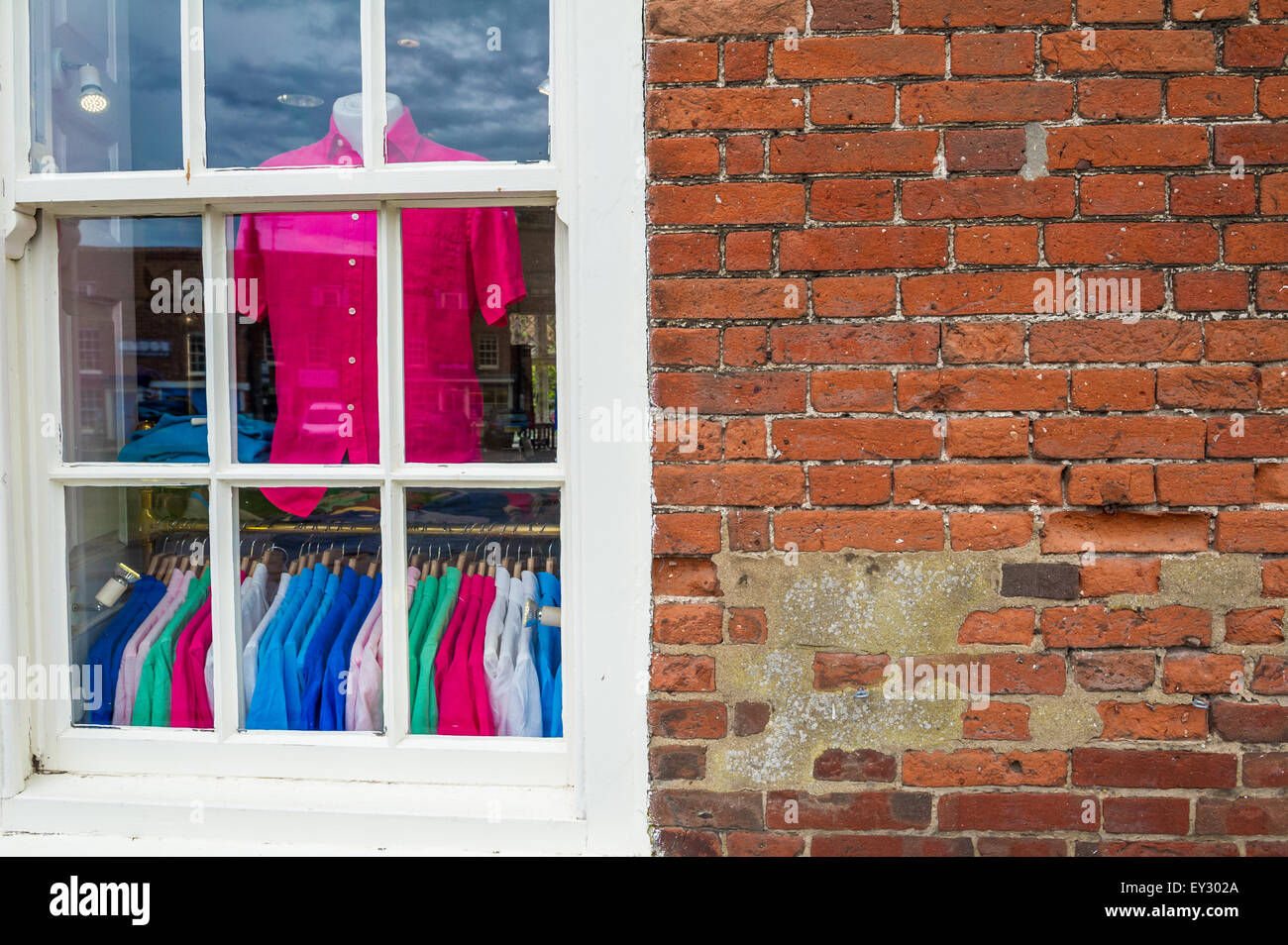 Colourful mens shirts in a shop window. Stock Photo