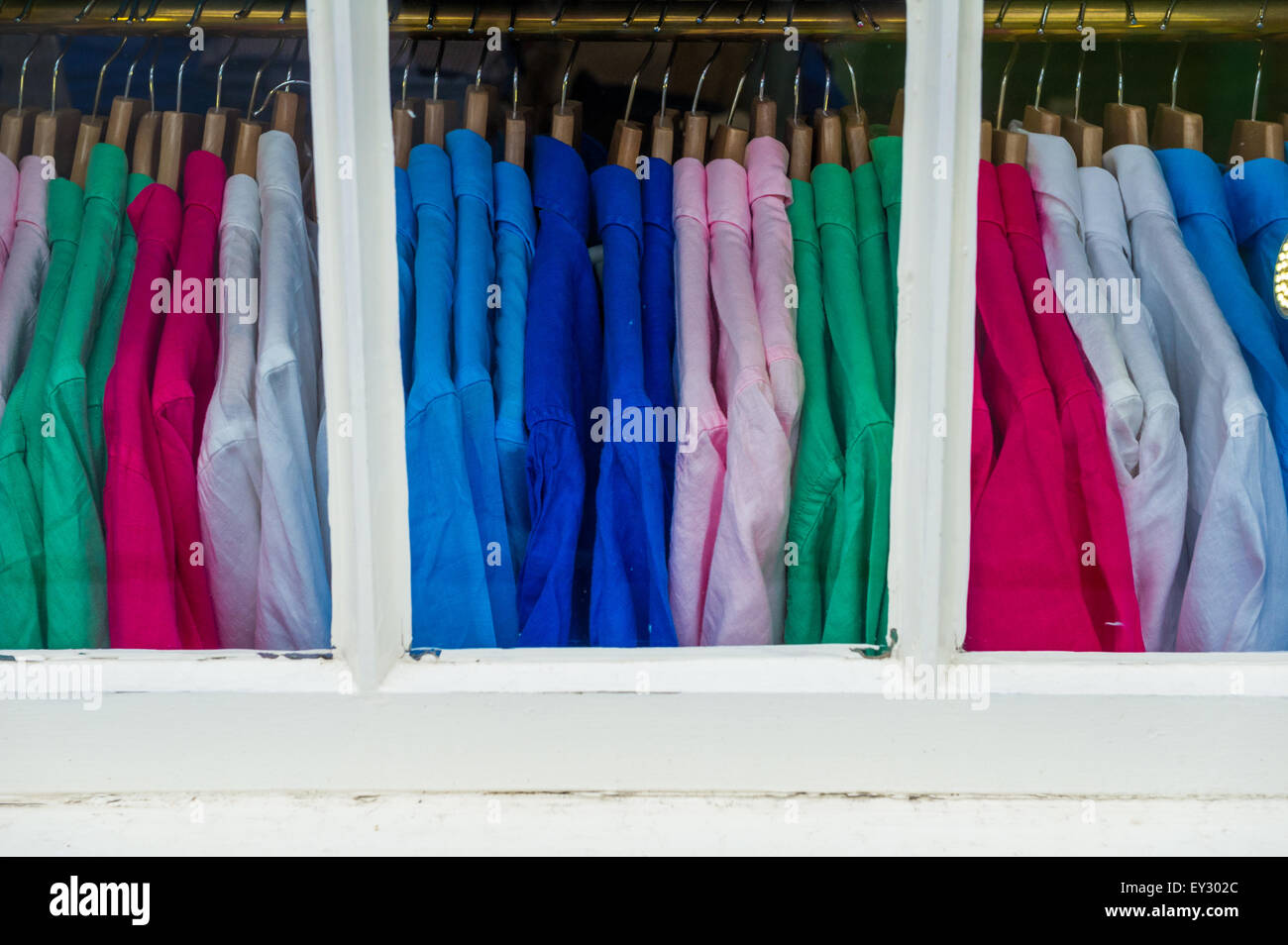 Colourful mens shirts in a shop window. Stock Photo