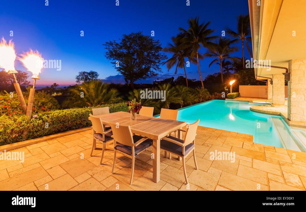 Beautiful Luxury Home with Swimming Pool at Sunset Stock Photo