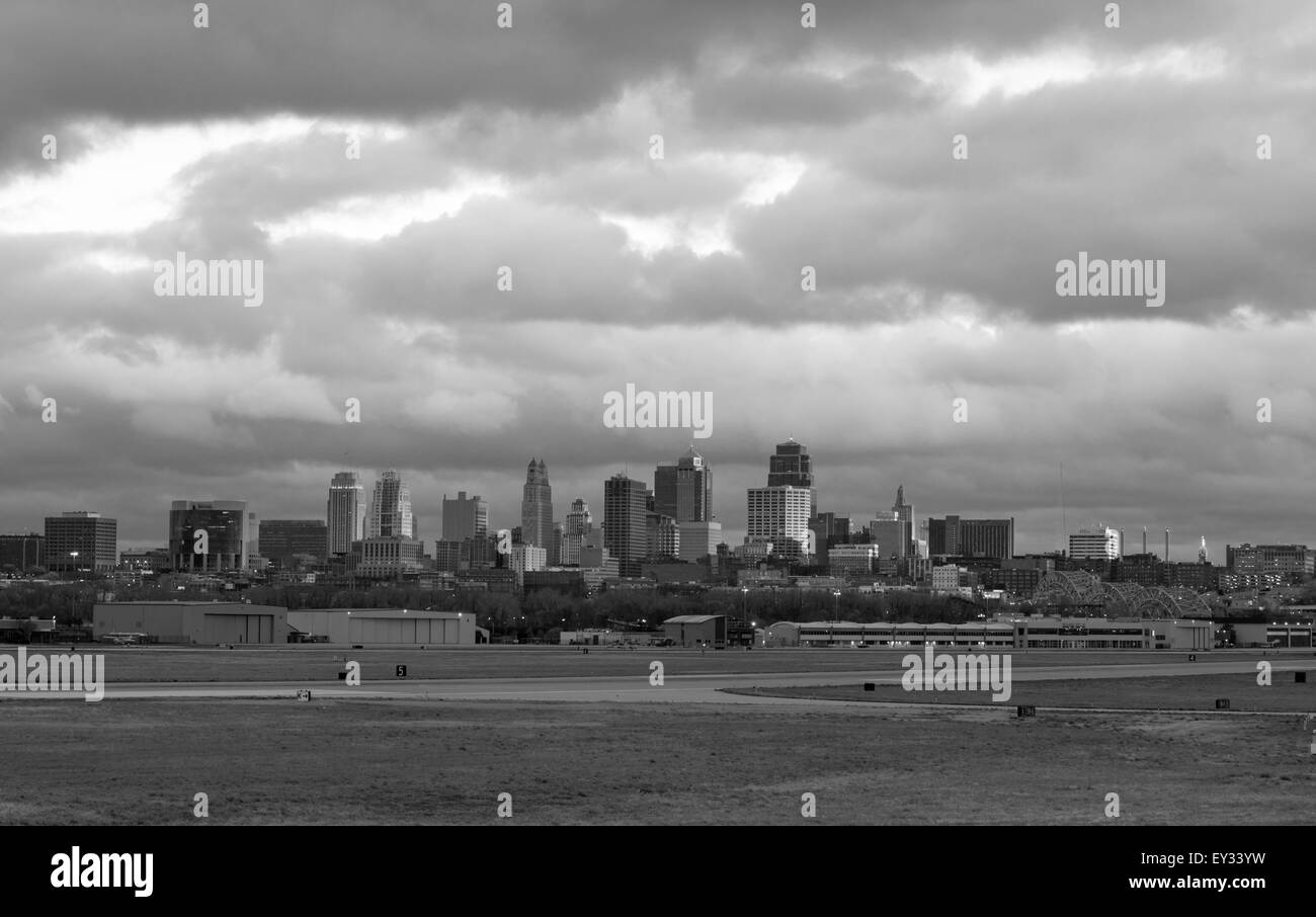 Beautiful light breaks through the clouds just before sunset to light Kansas City Missouri Stock Photo