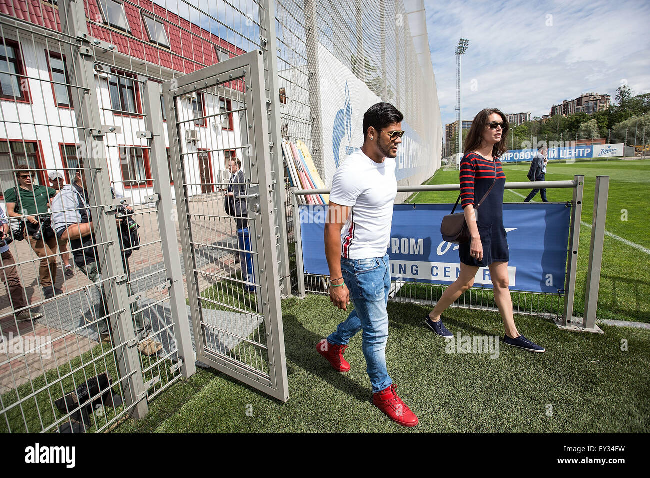 (150721) -- SAINT PETERSBURG, July 21, 2015 (XINHUA) -- Photo taken on July 20, 2015 shows Hulk (L) of the FC Zenit Saint Petersburg enters the training site in Saint Petersburg, Russia. Russia will host the FIFA World Cup soccer tournament in 2018. (Xinhua/Li Ming) Stock Photo