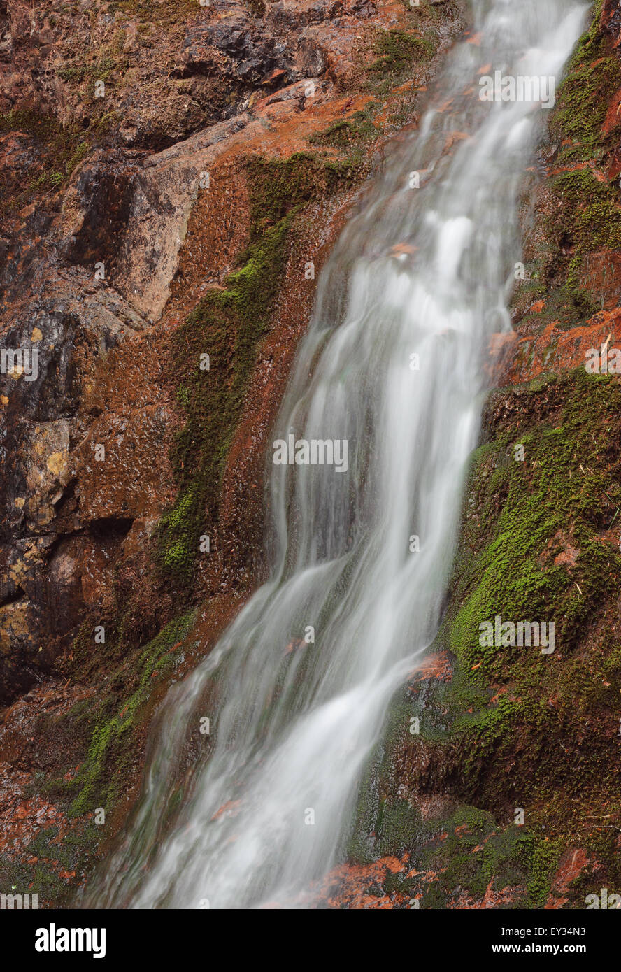 Small flowing waterfall detail. Stock Photo