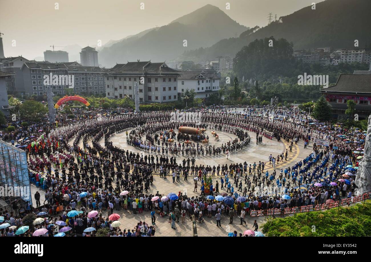 Jianhe, China's Guizhou Province. 21st July, 2015. People perform a