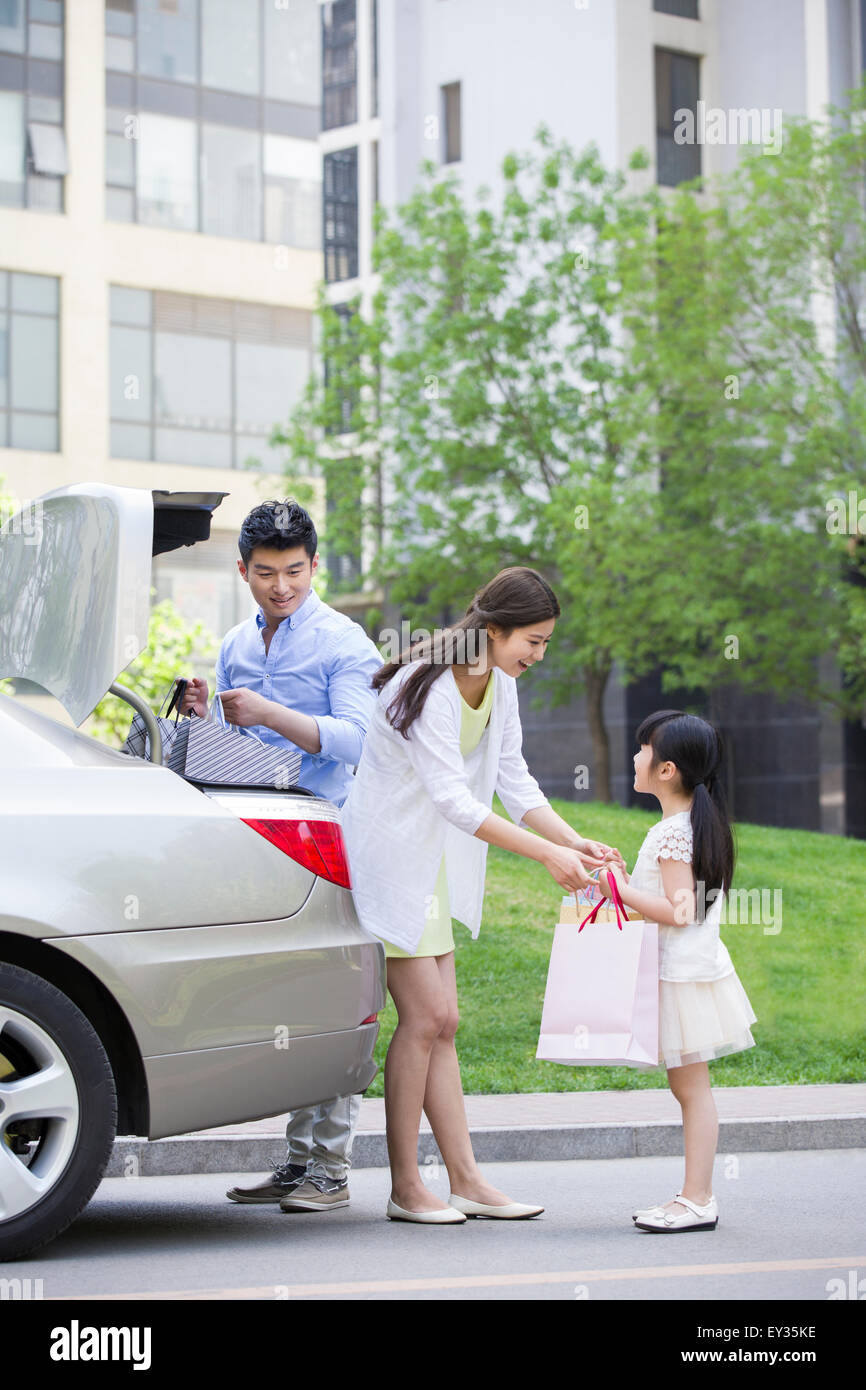 Young family coming back from shopping Stock Photo - Alamy