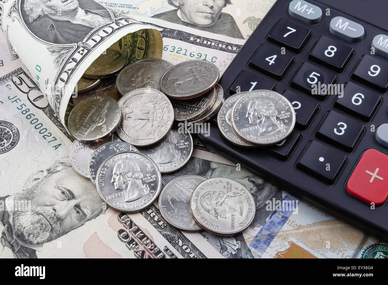 US Dollar coins and banknotes, with a calculator in the right side Stock  Photo - Alamy