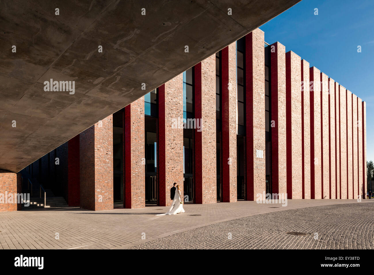 Perspective of red brick facade with public square. National Polish Radio Symphony Orchestra (NOSPR), Katowice, Poland. Architec Stock Photo