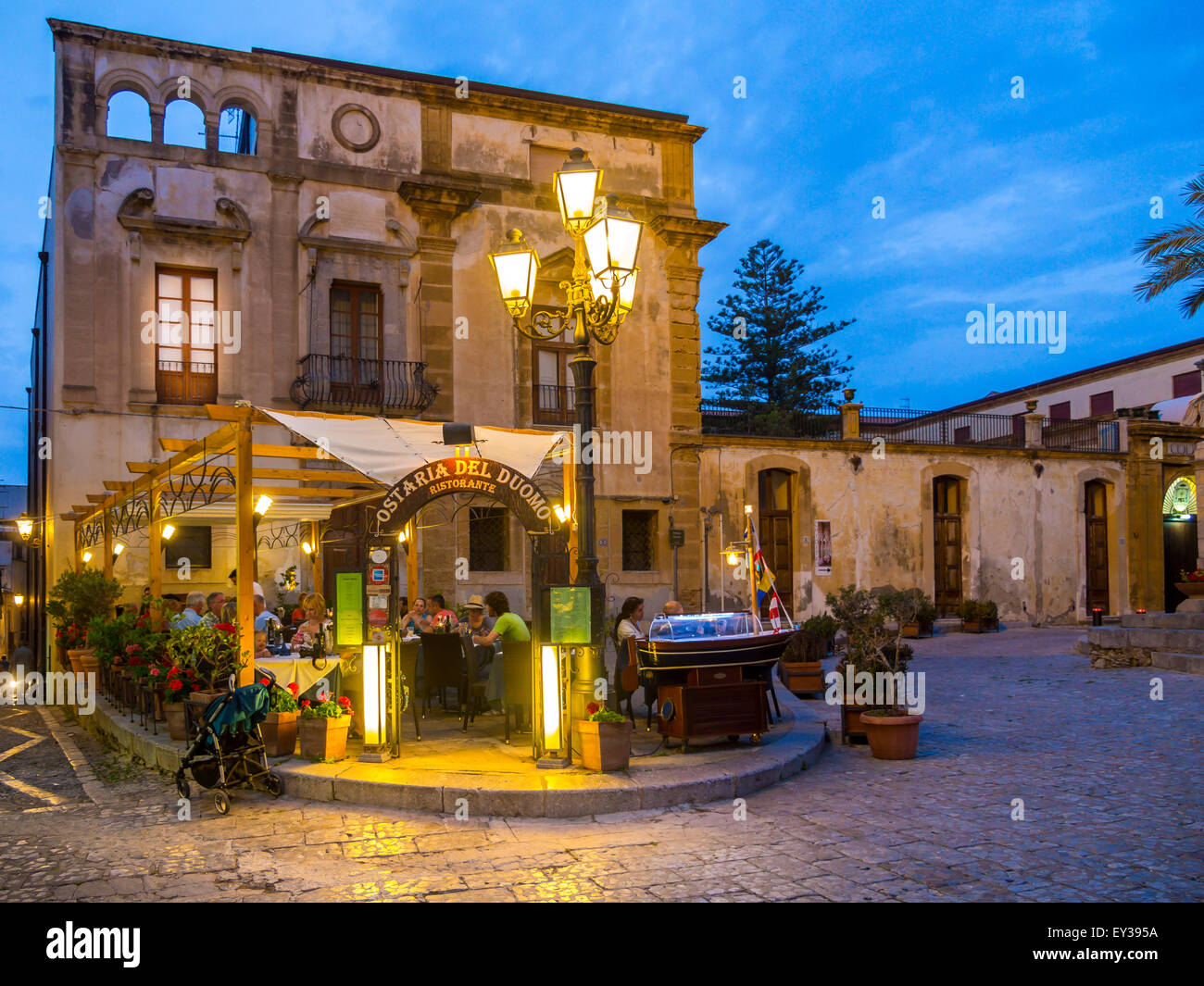 Restaurants on the Piazza del Duomo between medieval houses, Cefalu, Province of Palermo, Sicily, Italy Stock Photo