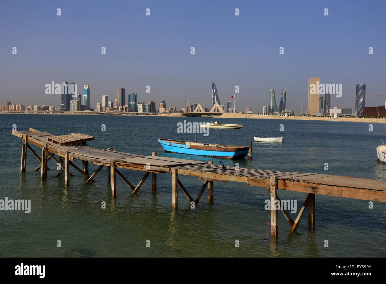 View of Manama from Muharraq with the Financial Harbor towers and World Trade Center in the distance, Kingdom of Bahrain Stock Photo