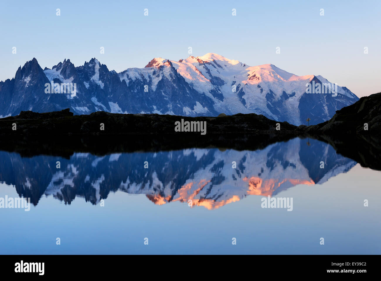 Mont Blanc massif at sunrise reflected in Lac de Chésserys, Montblanc on the right, Chamonix, France Stock Photo