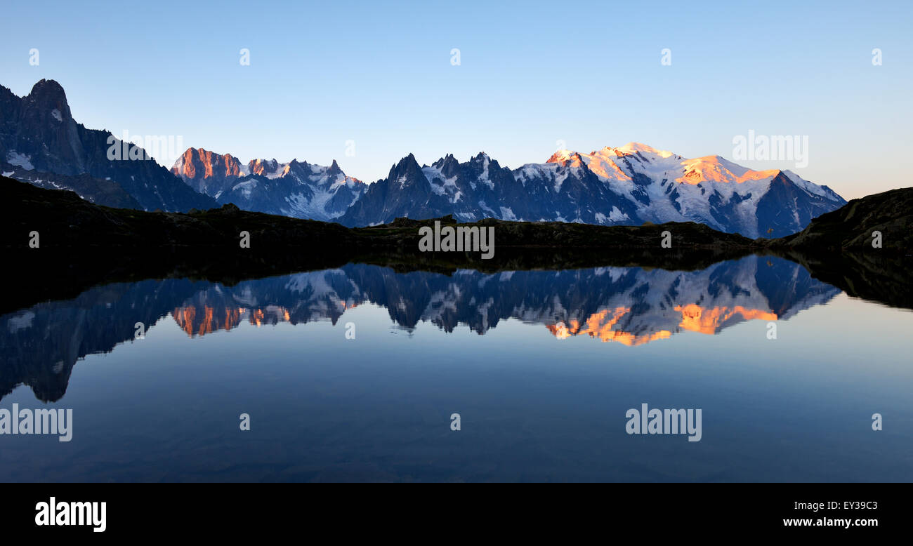 Mont Blanc massif at sunrise reflected in Lac de Ch??sserys, Aiguilles