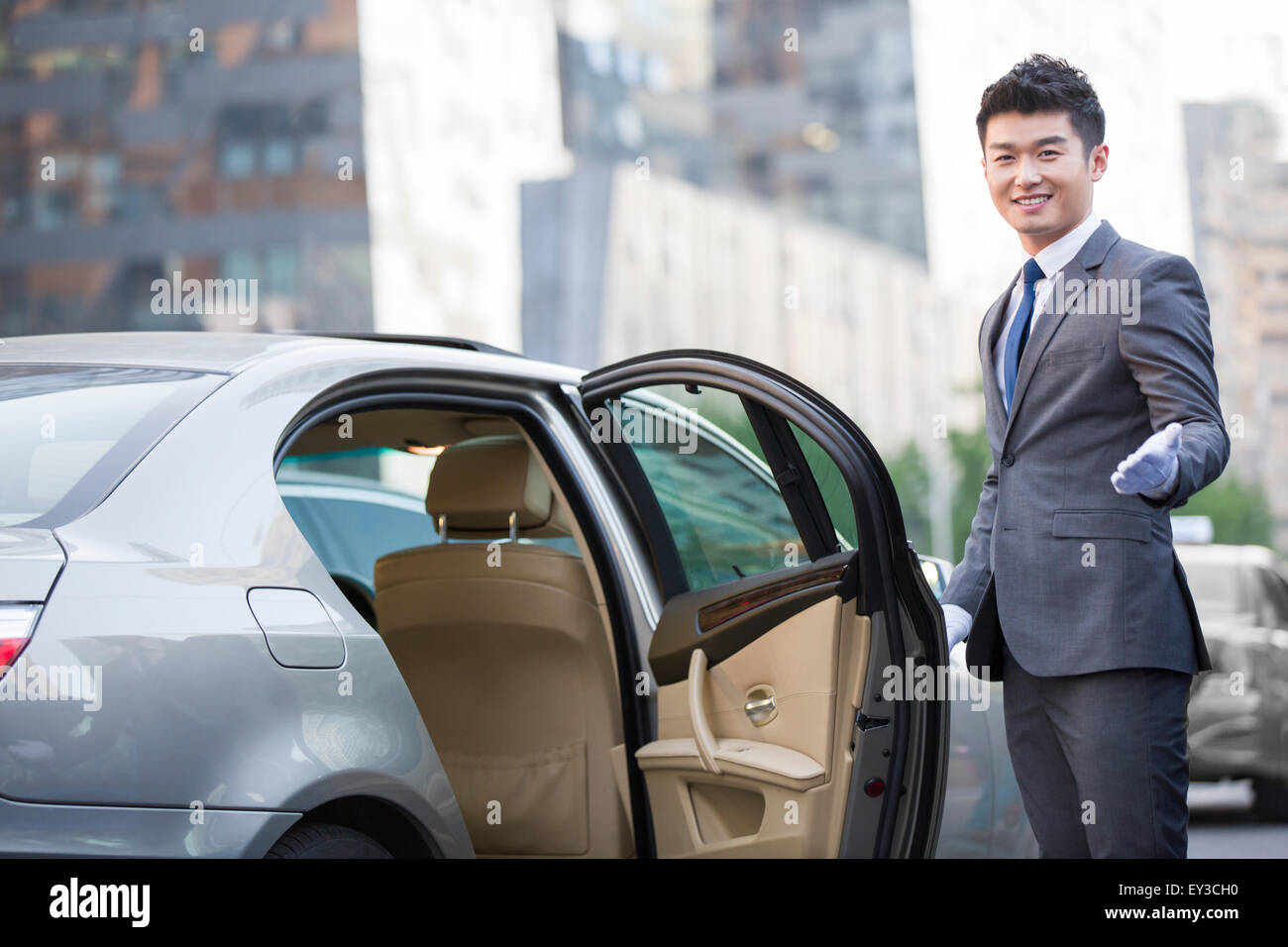 Chauffeur Opening Car Door Stock Photo 85512924 Alamy