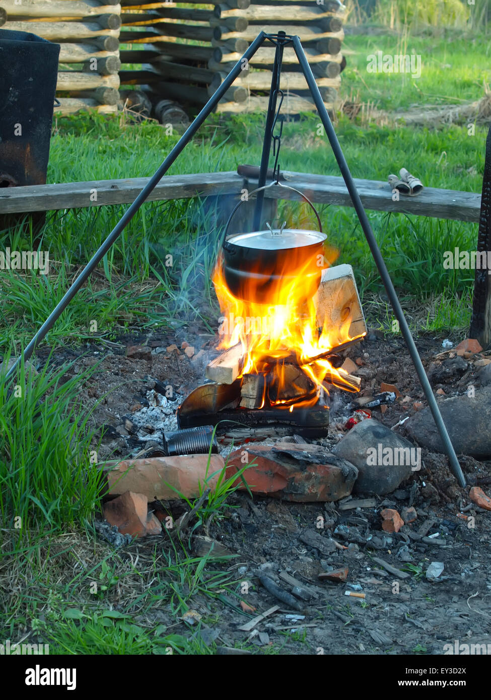 Campfire, old coffee pot on the fire hires stock photography and