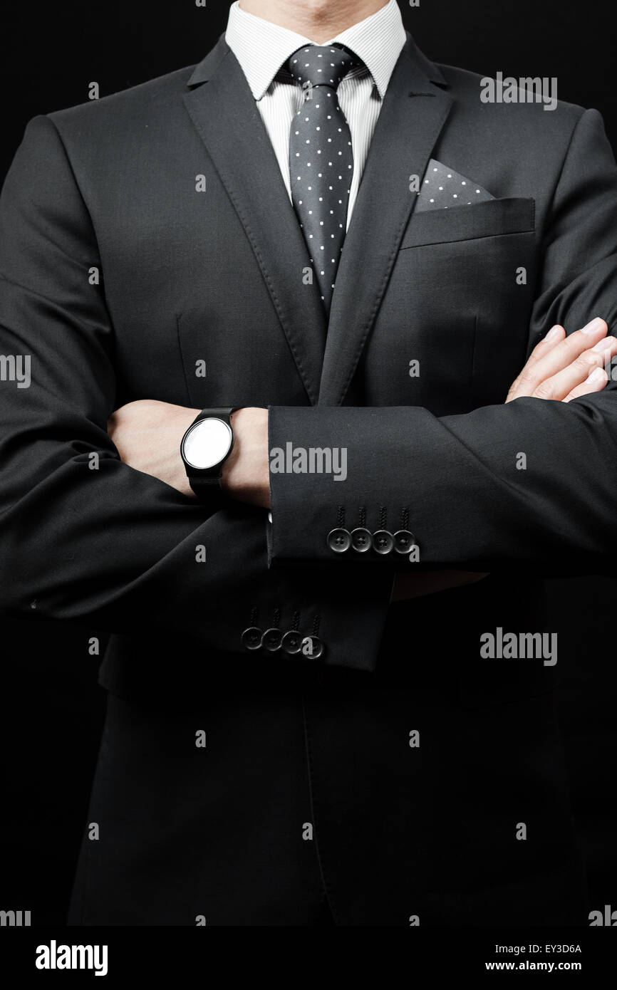 man in suit on a black background Stock Photo - Alamy