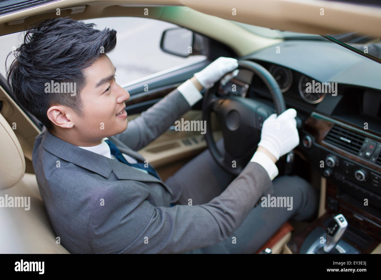 Chauffeur driving car Stock Photo Alamy