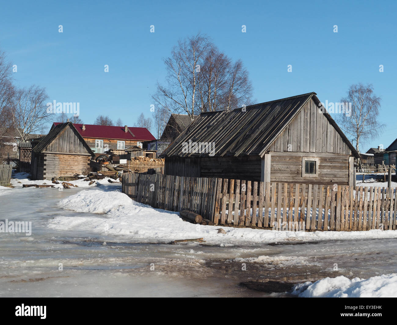 Wooden house in winter village Stock Photo - Alamy