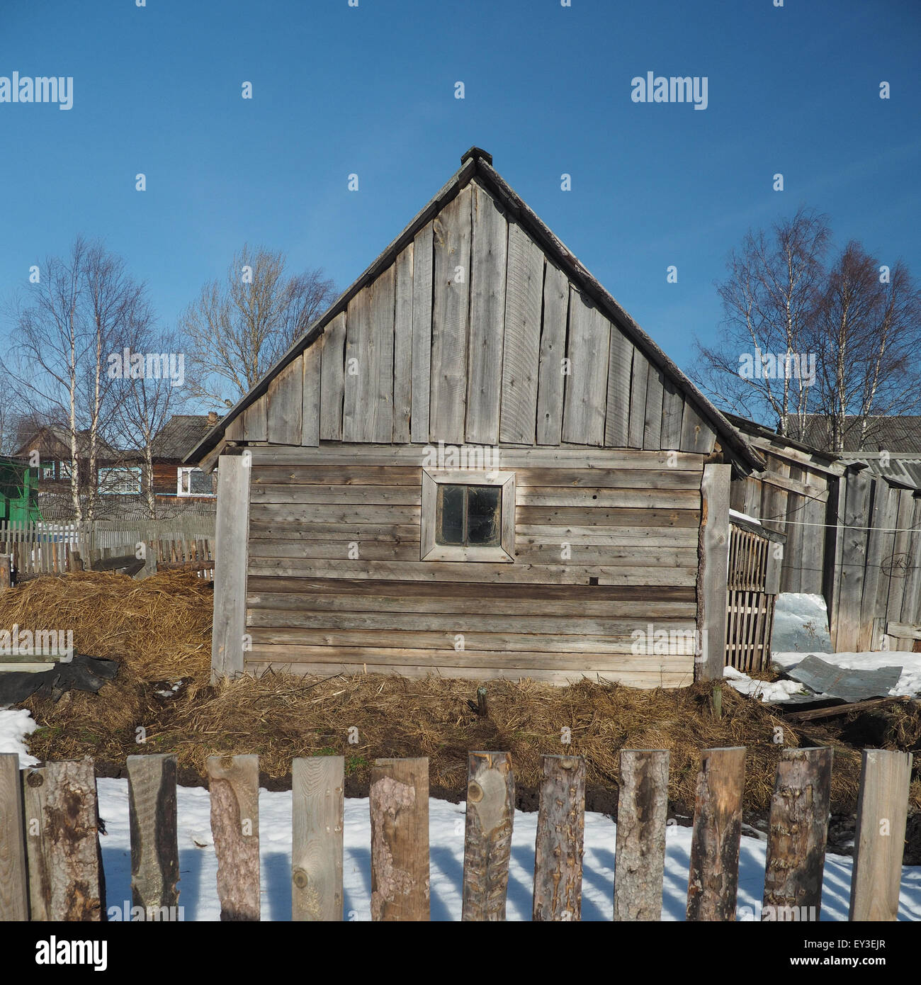 Wooden house in winter village Stock Photo - Alamy