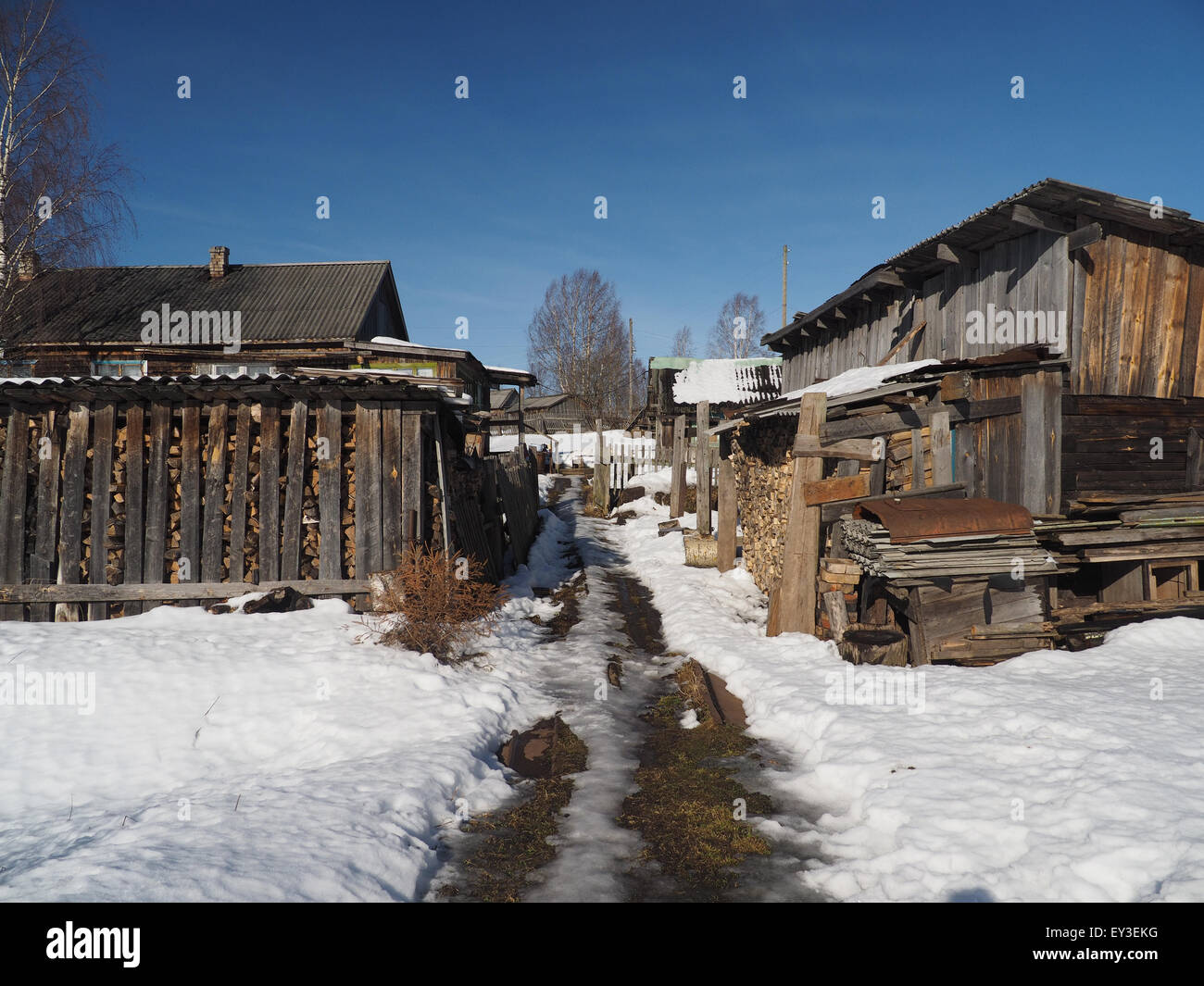 Wooden house in winter village Stock Photo - Alamy