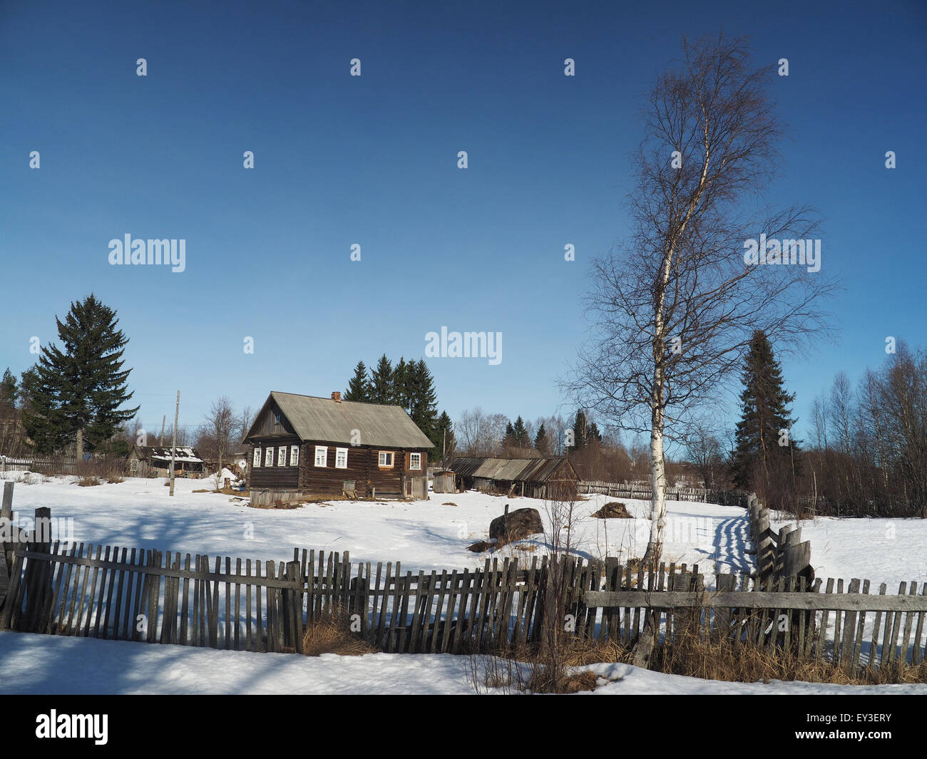 Wooden house in winter village Stock Photo - Alamy