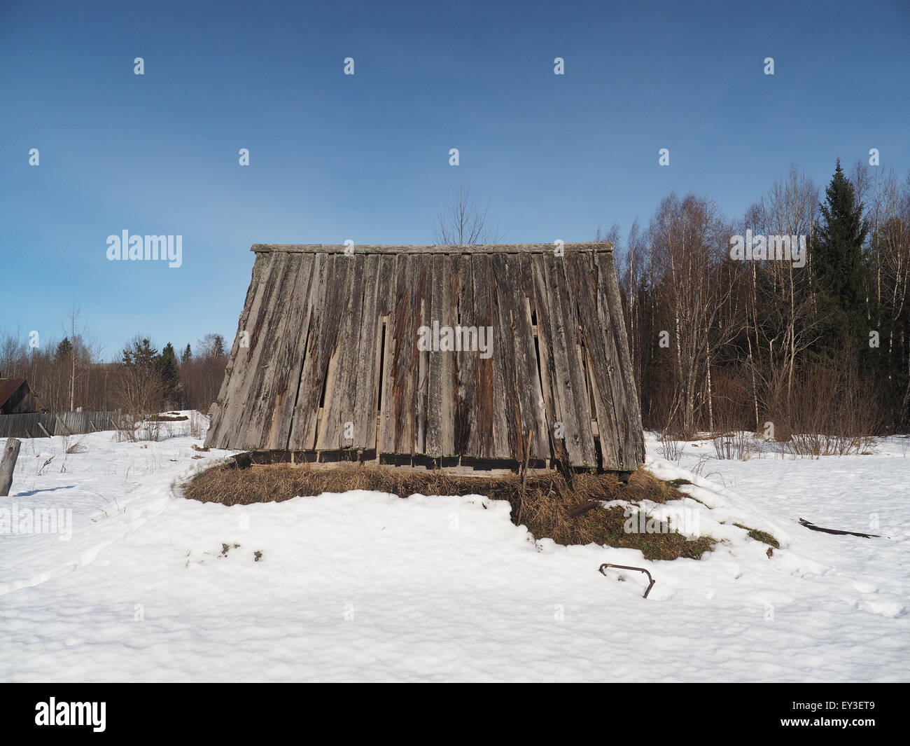 Wooden house in winter village Stock Photo - Alamy