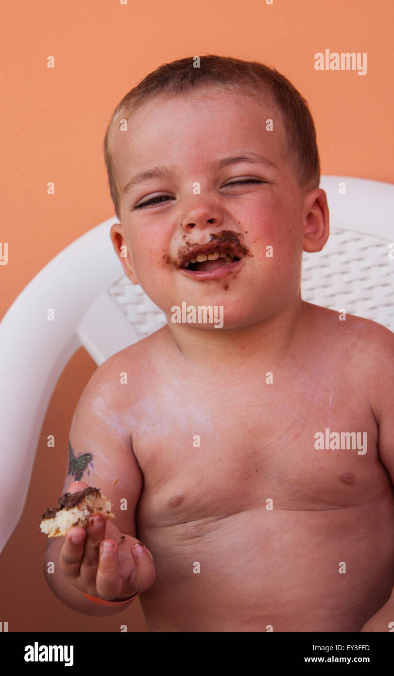 portrait child eating bread and chocolate Stock Photo
